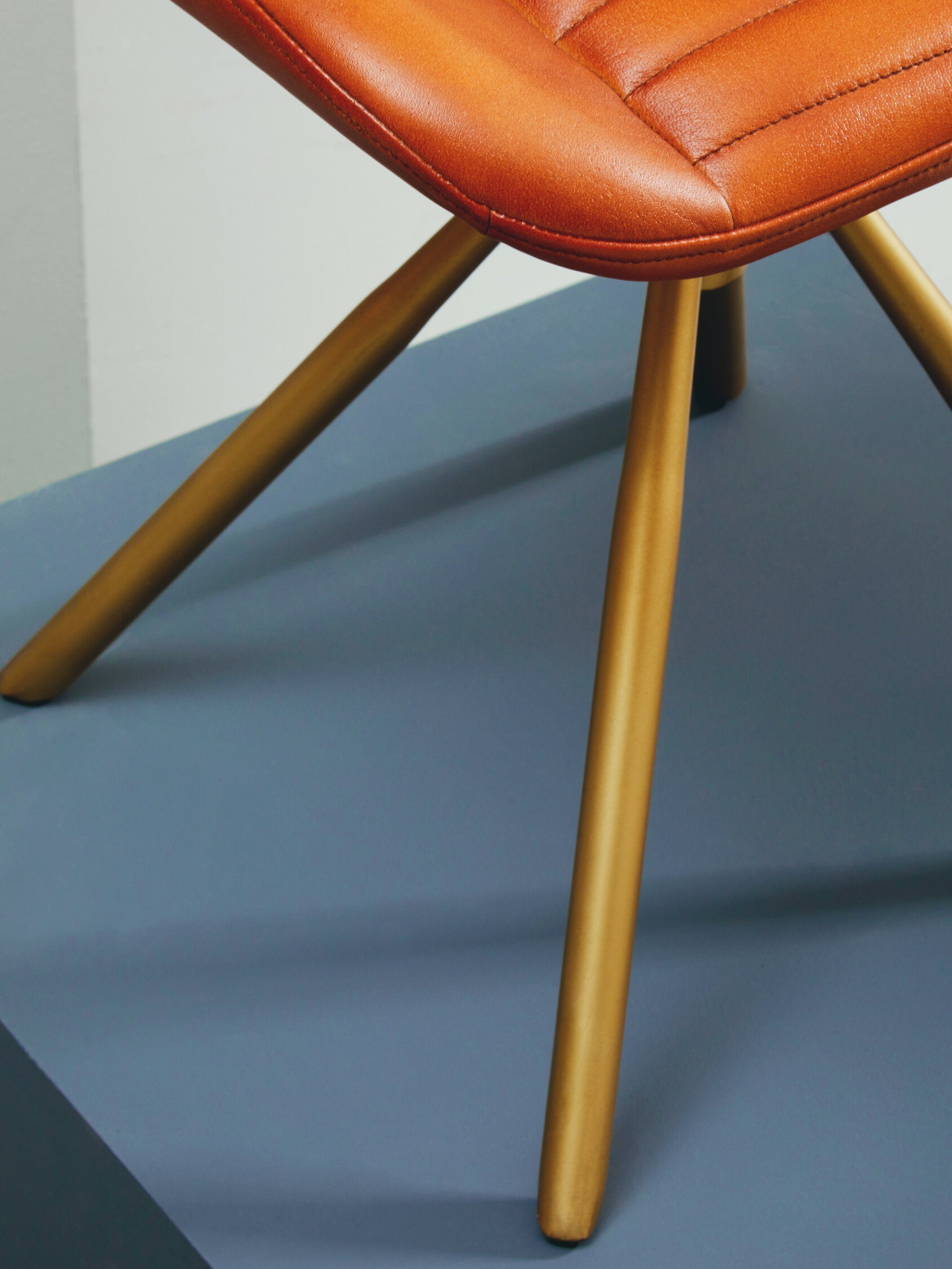 Buffalo Tan Leather and Gold Finish Footstool