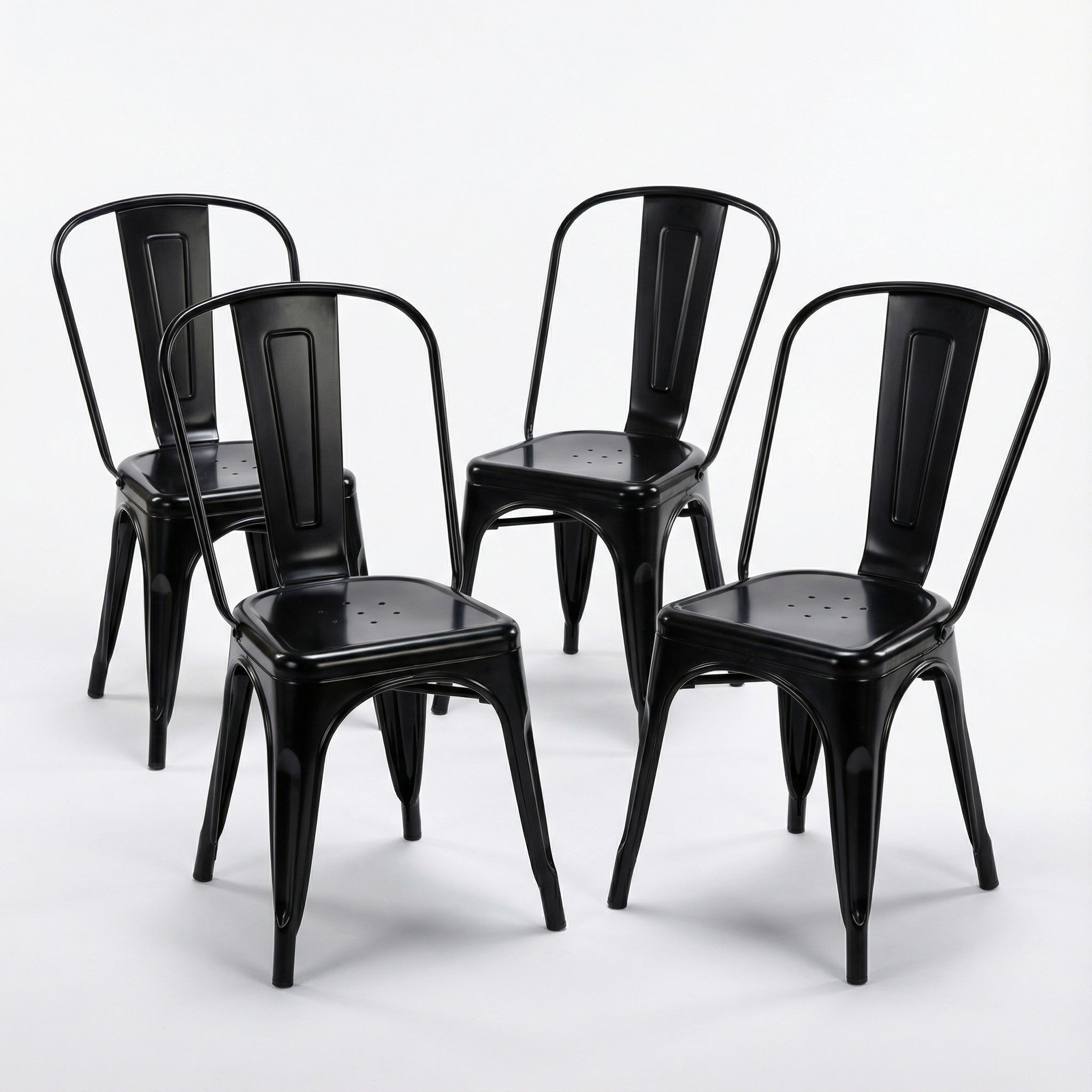 Four black metal chairs on a white background