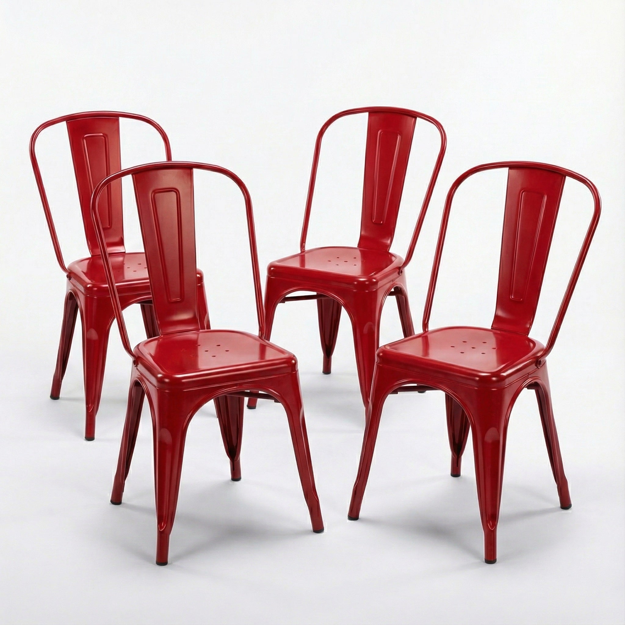 Four red metal chairs on a white background
