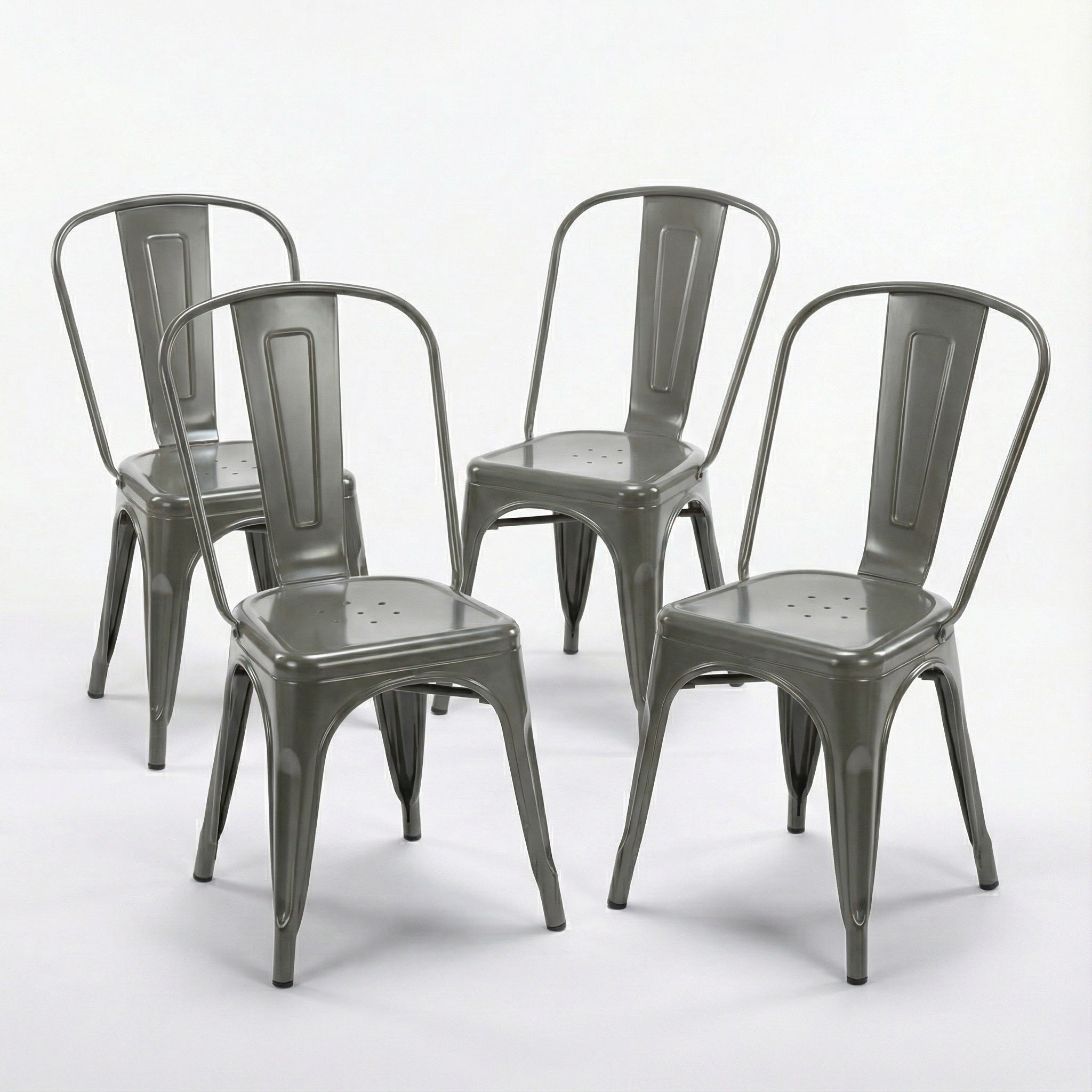 Set of four gray metal chairs on a white background