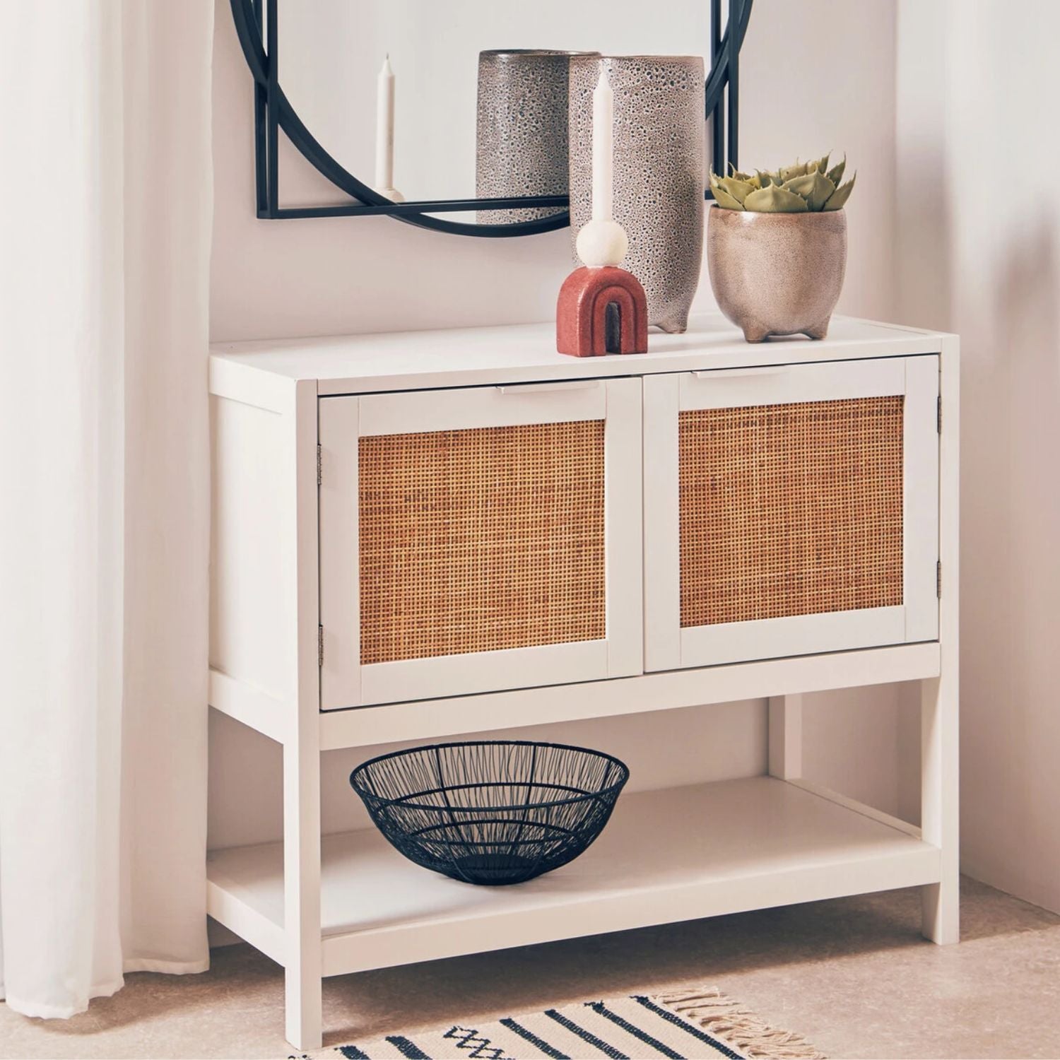 White cabinet with wicker doors in a room setting